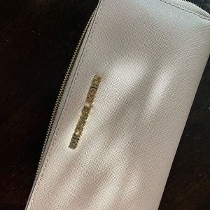 Michael Kors pink/tan Wallet in good condition.